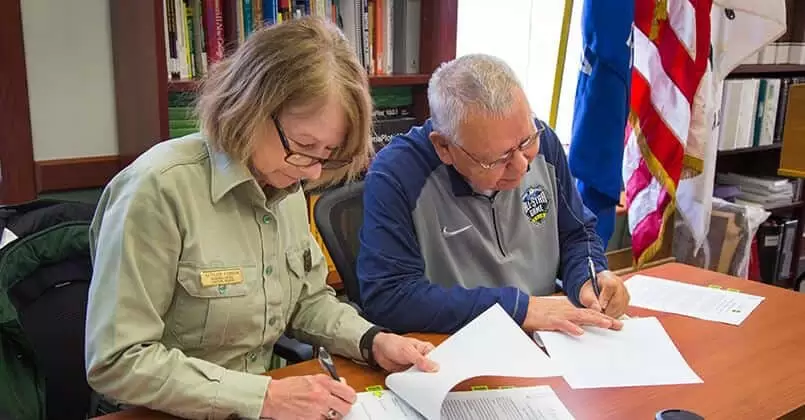 U.S. Forest Service Eastern Regional Forester Kathleen Atkinson and FCP Chairman Harold “Gus” Frank sign the MOU.