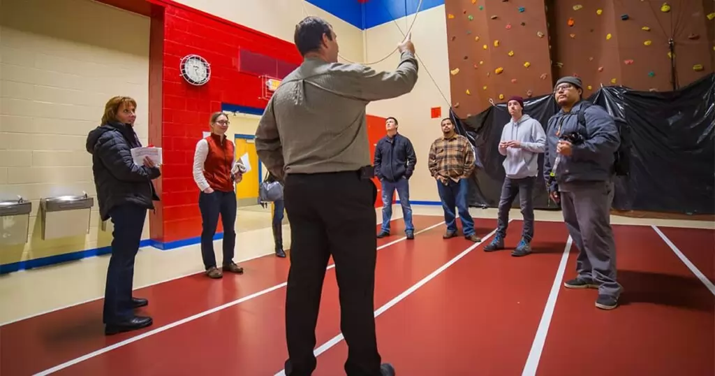 Tilley discussing topics with members