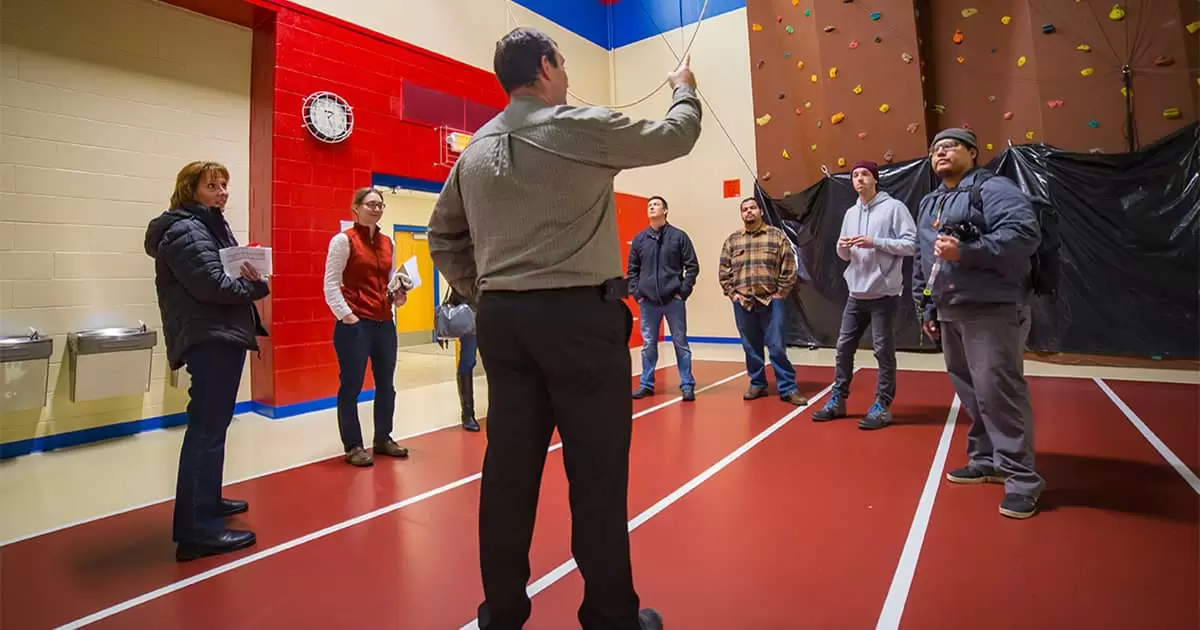 Tilley discussing topics with members