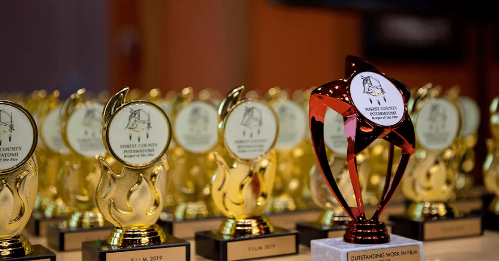 Enter through the double doors of the Executive Building. The first thing your brain registers is the smell of popcorn. Next, you see the Grammy-style back-drop and red carpet for all attendees to pose for pictures like celebrities.